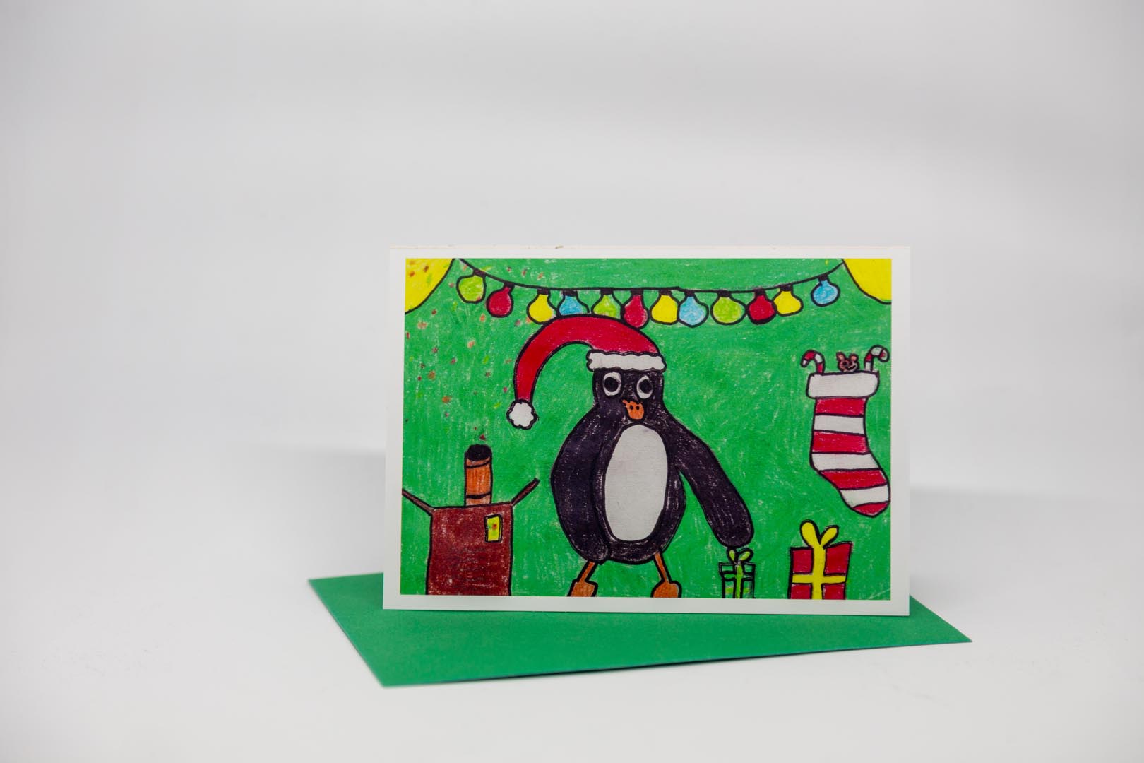 Weihnachtskarte: Pinguin mit Nikolausmütze