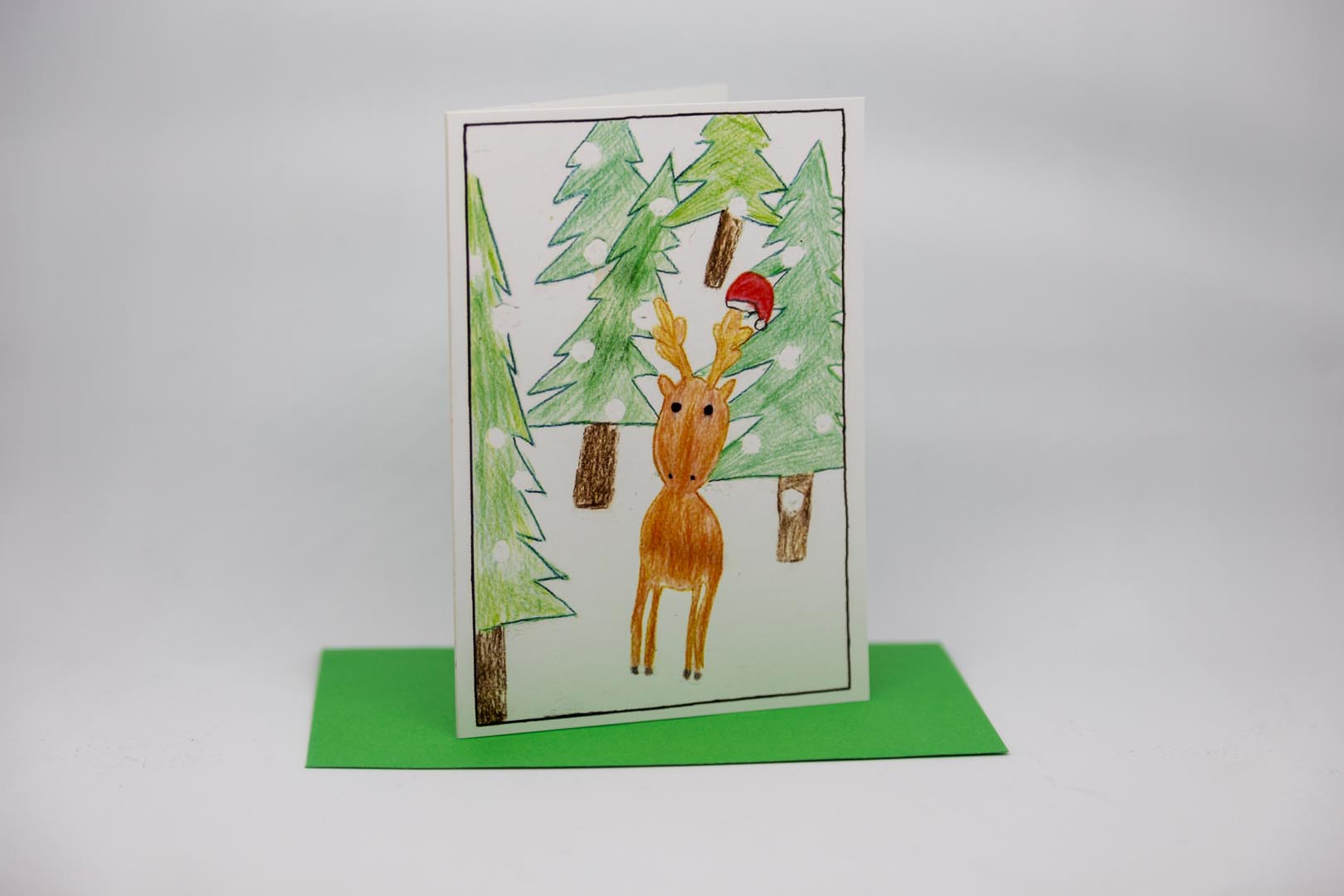 Weihnachtskarte: Rentier im Wald