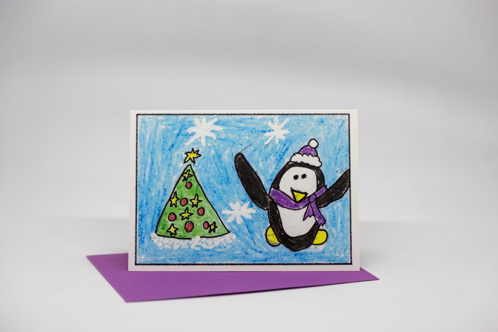 Weihnachtskarte: Pinguin mit Weihnachtsbaum