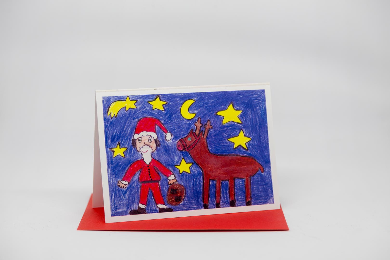 Weihnachtskarte: Weihnachtsmann mit Rentier