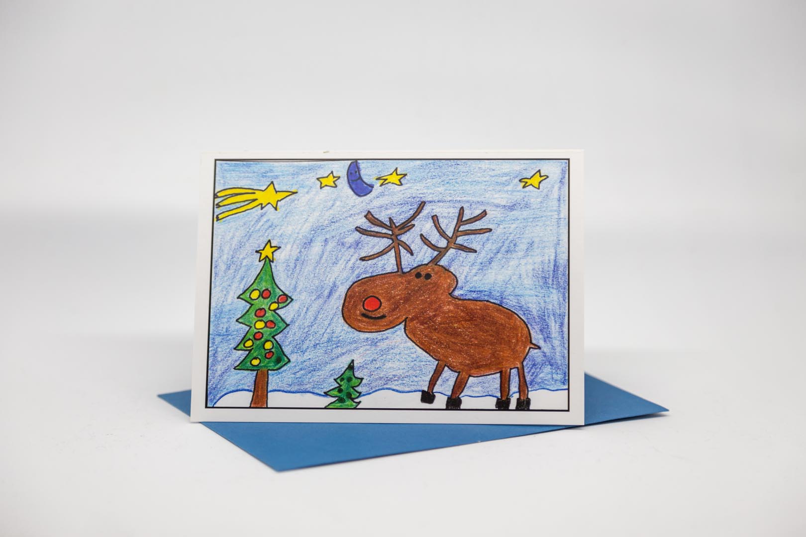 Weihnachtskarte: Rentier mit Weihnachtsbaum